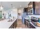 Modern kitchen with stainless steel appliances, light countertops, and a view to other rooms at 275 Hunters Ridge Dr, Danville, IN 46122