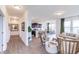 Open-concept living area with hardwood floors and seamless transition between living spaces at 275 Hunters Ridge Dr, Danville, IN 46122