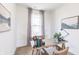 Bright home office with a wooden desk, chair, and natural light from the window at 275 Hunters Ridge Dr, Danville, IN 46122