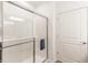 All-glass shower with silver hardware, white tile, and a small blue towel at 275 Hunters Ridge Dr, Danville, IN 46122