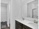 Bathroom with double sink vanity and walk-in closet access at 275 Hunters Ridge Dr, Danville, IN 46122