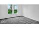 Neutral bedroom boasts a carpet floor and bright white walls at 275 Hunters Ridge Dr, Danville, IN 46122