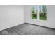 Neutral bedroom boasts a carpet floor and bright white walls at 275 Hunters Ridge Dr, Danville, IN 46122