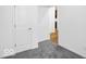 Bedroom showcasing neutral walls with a peek of hardwood flooring beyond the door at 275 Hunters Ridge Dr, Danville, IN 46122