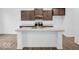 Modern kitchen with a large island, stainless steel appliances, and sleek countertops at 275 Hunters Ridge Dr, Danville, IN 46122
