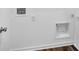 Laundry room with hookups, white trim and light wood grain floors at 275 Hunters Ridge Dr, Danville, IN 46122