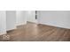 Large living room with attractive wood-look floors, and white painted walls at 275 Hunters Ridge Dr, Danville, IN 46122