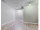 A finished basement area offers flexible space, featuring light wood flooring, neutral colors, and recessed lighting at 3039 Armory Dr, Indianapolis, IN 46208
