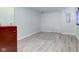 A partially finished basement area offers flexible space, featuring light wood flooring at 3039 Armory Dr, Indianapolis, IN 46208