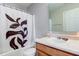 Functional bathroom with a tub/shower and a white floral curtain at 3039 Armory Dr, Indianapolis, IN 46208