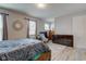This comfortable bedroom features a dresser and neutral walls at 3039 Armory Dr, Indianapolis, IN 46208