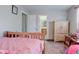 Bright bedroom with hardwood floors, a large window, and ample closet space, perfect for comfortable living at 3039 Armory Dr, Indianapolis, IN 46208