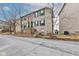 Charming townhome with brick facade and landscaped front at 3039 Armory Dr, Indianapolis, IN 46208