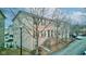 Charming brick townhome with green shutters and door at 3039 Armory Dr, Indianapolis, IN 46208