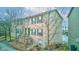 Charming brick townhome with green shutters and door at 3039 Armory Dr, Indianapolis, IN 46208