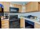 Modern kitchen with sleek black appliances and ample counter space at 3039 Armory Dr, Indianapolis, IN 46208