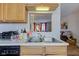 Functional kitchen with stainless steel sink, and wood cabinetry at 3039 Armory Dr, Indianapolis, IN 46208