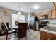 Eat-in kitchen with modern appliances, window and wood cabinets at 3039 Armory Dr, Indianapolis, IN 46208
