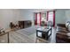 Cozy living room with chandelier, hardwood floors and vibrant artwork at 3039 Armory Dr, Indianapolis, IN 46208