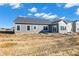 Home featuring sliding glass doors, many windows, and a spacious backyard at 3687 Thomas Jefferson Ct, Westfield, IN 46074