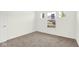 Bright bedroom featuring neutral carpet, white walls, and multiple windows letting in natural light at 3687 Thomas Jefferson Ct, Westfield, IN 46074