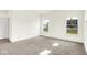 Bedroom with plush carpet, two bright windows, and view to the exterior at 3687 Thomas Jefferson Ct, Westfield, IN 46074