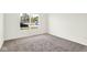 Bright carpeted bedroom with natural light from a single window at 3687 Thomas Jefferson Ct, Westfield, IN 46074