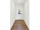 A bright entryway features a white door with glass and wood laminate flooring at 3687 Thomas Jefferson Ct, Westfield, IN 46074
