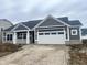 Charming single-story home featuring gray siding, white trim, and an attached two-car garage at 3687 Thomas Jefferson Ct, Westfield, IN 46074