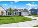 Charming one-story home with a well-manicured front yard, a covered porch, and an attached two-car garage at 3687 Thomas Jefferson Ct, Westfield, IN 46074