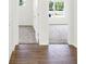 Hallway view with carpet in the bedrooms and wood flooring in the hall at 3687 Thomas Jefferson Ct, Westfield, IN 46074