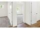 Hallway view showing an adjacent carpeted bedroom with a window to the exterior at 3687 Thomas Jefferson Ct, Westfield, IN 46074