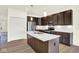 Modern kitchen featuring a large island, stainless steel appliances, and white cabinets at 3687 Thomas Jefferson Ct, Westfield, IN 46074