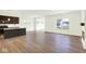 Open concept space with a kitchen island, stainless appliances, and wood laminate flooring at 3687 Thomas Jefferson Ct, Westfield, IN 46074