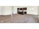 Open concept living space featuring wood laminate flooring, kitchen, and natural light at 3687 Thomas Jefferson Ct, Westfield, IN 46074