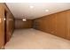 Basement featuring wood paneling and carpeting, and recessed lighting at 3810 Springfield Overlook St, Indianapolis, IN 46234
