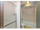 The bathroom features a glass-enclosed shower, toilet, and a vintage tiled floor at 3810 Springfield Overlook St, Indianapolis, IN 46234