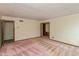 Spacious bedroom showcasing pink carpet, wallpapered walls, and natural light, adjoining an en suite vanity area at 3810 Springfield Overlook St, Indianapolis, IN 46234