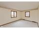 Bedroom offering carpet, natural light from two windows and neutral-colored walls with a decorative border at 3810 Springfield Overlook St, Indianapolis, IN 46234