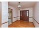 Traditional entryway featuring hardwood floors, classic wallpaper, and a stylish chandelier at 3810 Springfield Overlook St, Indianapolis, IN 46234