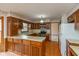 Charming kitchen featuring ample counter space, natural wood cabinets and stainless-steel appliances at 3810 Springfield Overlook St, Indianapolis, IN 46234
