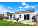 View of the outdoor deck featuring a grill, patio table set, and sliding glass doors at 4051 Presidio Cir, Indianapolis, IN 46235