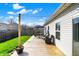 Outdoor deck perfect for entertaining with patio furniture, grill and grassy backyard at 4051 Presidio Cir, Indianapolis, IN 46235