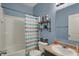 Well-lit bathroom features a shower-tub combination and vanity with ample counter space at 4051 Presidio Cir, Indianapolis, IN 46235