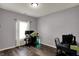Well-lit bedroom features wood-look flooring and space for office or gaming setup at 4051 Presidio Cir, Indianapolis, IN 46235