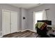 Bedroom features wood-look flooring, closet, and neutral paint, ready for personalization at 4051 Presidio Cir, Indianapolis, IN 46235