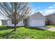 Charming single-story home with a well-maintained lawn and attached two-car garage at 4051 Presidio Cir, Indianapolis, IN 46235