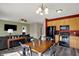 Open kitchen area with dining table, black appliances, and view to the living room at 4051 Presidio Cir, Indianapolis, IN 46235