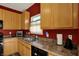Kitchen with stainless steel sink, modern appliances, and a window view at 4051 Presidio Cir, Indianapolis, IN 46235
