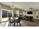 Inviting living room with sliding glass doors, dining area, and wood flooring at 4051 Presidio Cir, Indianapolis, IN 46235